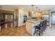 Spacious kitchen with a large granite island, stainless steel appliances, and counter seating at 8520 Wright Rd, Kannapolis, NC 28081