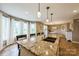 Kitchen island with a breakfast bar, granite countertop, and pendant lighting at 8520 Wright Rd, Kannapolis, NC 28081