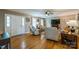 Comfortable living room with hardwood floors, fireplace, and a ceiling fan to complete the space at 8520 Wright Rd, Kannapolis, NC 28081