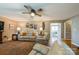 Bright living room with hardwood flooring, ceiling fan, a fireplace, and ample seating at 8520 Wright Rd, Kannapolis, NC 28081