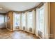 Bright sunroom filled with lots of natural light, neutral tones and beautiful tile flooring at 8520 Wright Rd, Kannapolis, NC 28081