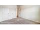 Neutral bedroom with a carpet, two closets, and an open door at 8619 Frank Grier Rd # 3, Charlotte, NC 28215