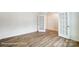 Spacious bedroom with hardwood floors and French doors, offering an open feel at 8619 Frank Grier Rd # 3, Charlotte, NC 28215