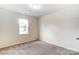 Bright bedroom with neutral carpet, a window and ample natural light at 8619 Frank Grier Rd # 3, Charlotte, NC 28215