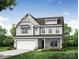 Charming two-story home featuring stone accents, a covered front porch, and an attached two-car garage at 8619 Frank Grier Rd # 3, Charlotte, NC 28215