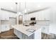 Island kitchen with quartz countertops, stainless steel appliances, and pendant lighting at 8619 Frank Grier Rd # 3, Charlotte, NC 28215