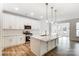 Bright, open kitchen with white cabinets, stainless appliances, and a large center island at 8619 Frank Grier Rd # 3, Charlotte, NC 28215