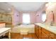 Bathroom with a soaking tub, tiled shower, and wood vanity at 907 Sikes Mill Rd, Monroe, NC 28110