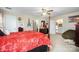 Spacious bedroom featuring carpet, a four-poster bed, with entryways to other rooms at 907 Sikes Mill Rd, Monroe, NC 28110