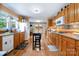 Kitchen featuring warm wood cabinets and access to the outdoors at 907 Sikes Mill Rd, Monroe, NC 28110