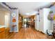 Open kitchen with wood cabinets, granite counters, and stainless steel appliances at 907 Sikes Mill Rd, Monroe, NC 28110