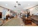 Relaxing living room with hardwood floors, comfortable seating, a decorative rug and warm lighting at 907 Sikes Mill Rd, Monroe, NC 28110