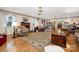 Inviting living room featuring a fireplace, hardwood floors, and comfortable armchairs and sofas at 907 Sikes Mill Rd, Monroe, NC 28110