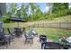 Spacious backyard featuring a patio, dining set, and fire pit at 980 Prince Garrett Way, Denver, NC 28037