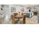 Charming dining area adjacent to the kitchen with a round table and stylish decor at 980 Prince Garrett Way, Denver, NC 28037