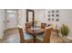 Cozy dining area with a round table, wicker chairs, and a rustic bench at 980 Prince Garrett Way, Denver, NC 28037