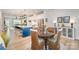 Bright kitchen features a large island with seating, stainless steel appliances, and opens to dining area at 980 Prince Garrett Way, Denver, NC 28037