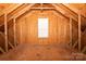 Unfinished attic space with exposed wooden beams and framing at 10008 King George Ln, Waxhaw, NC 28173