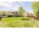 Spacious backyard with manicured lawn, trees and a wooden fence at 10008 King George Ln, Waxhaw, NC 28173