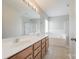 Bright bathroom featuring a soaking tub, shower, and double vanity at 10008 King George Ln, Waxhaw, NC 28173