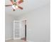 Neutral bedroom showcasing a ceiling fan and a door to the Primary bathroom at 10008 King George Ln, Waxhaw, NC 28173