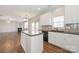 Stylish kitchen showcasing a center island, modern appliances, and seamless access to the living area at 10008 King George Ln, Waxhaw, NC 28173