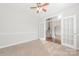 Bright room showcasing French doors, carpeted floors, and neutral decor at 10008 King George Ln, Waxhaw, NC 28173