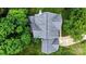 Aerial view of home with a large backyard, mature trees, and beautiful landscaping at 10434 Blackstock Rd, Huntersville, NC 28078