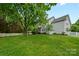 Spacious backyard with a white picket fence, a screened-in porch and plenty of green space at 10434 Blackstock Rd, Huntersville, NC 28078