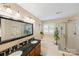 Spacious bathroom with double sinks, granite countertops, a soaking tub, and a separate shower at 10434 Blackstock Rd, Huntersville, NC 28078