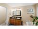 Bathroom with a double vanity featuring granite countertops and ample cabinet storage space at 10434 Blackstock Rd, Huntersville, NC 28078