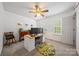 Bright bedroom with a ceiling fan, a comfortable chair, and a workspace by the window at 10434 Blackstock Rd, Huntersville, NC 28078