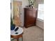 This bedroom features a tall wooden dresser with drawers and a bright window at 10434 Blackstock Rd, Huntersville, NC 28078