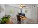 Bright bedroom with a ceiling fan, home office space, and comfortable natural light at 10434 Blackstock Rd, Huntersville, NC 28078