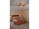 Spacious bedroom featuring a ceiling fan and unique chaise lounge, creating a cozy and inviting atmosphere at 10434 Blackstock Rd, Huntersville, NC 28078