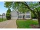 Traditional two-story home with black shutters, manicured lawn, and an attached two-car garage at 10434 Blackstock Rd, Huntersville, NC 28078
