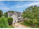 Traditional two-story home boasting lush lawn, attached garage, and a classic American facade at 10434 Blackstock Rd, Huntersville, NC 28078