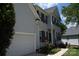 Charming two-story home boasting a well-maintained exterior, attached garage, and inviting curb appeal at 10434 Blackstock Rd, Huntersville, NC 28078