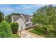 Charming two-story home with a well-manicured lawn and basketball hoop on the driveway at 10434 Blackstock Rd, Huntersville, NC 28078