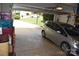 View of a two car garage with the door up, and a view into the front yard beyond at 10434 Blackstock Rd, Huntersville, NC 28078