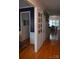 Hallway with hardwood floors, stylish decor, and access to the dining area and other rooms at 10434 Blackstock Rd, Huntersville, NC 28078
