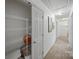Bright hallway featuring ample storage space, neutral decor, and carpet flooring at 10434 Blackstock Rd, Huntersville, NC 28078