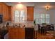 Cozy kitchen flows into the dining room area with natural light and stainless steel appliances at 10434 Blackstock Rd, Huntersville, NC 28078