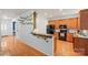 Spacious kitchen with oak cabinets, modern appliances, and hardwood flooring at 10434 Blackstock Rd, Huntersville, NC 28078