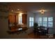 Cozy kitchen and dining area featuring wood cabinets and hardwood flooring for a warm, inviting feel at 10434 Blackstock Rd, Huntersville, NC 28078