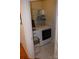 Functional laundry room with modern washer and dryer, plus storage shelving at 10434 Blackstock Rd, Huntersville, NC 28078
