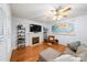 Bright living room with a fireplace, hardwood floors, and a decorative world map at 10434 Blackstock Rd, Huntersville, NC 28078