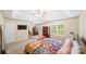 A bright main bedroom suite features a trey ceiling, a decorative bed, and sunny windows at 10434 Blackstock Rd, Huntersville, NC 28078