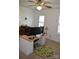 This office features a large desk, an office chair, and a ceiling fan at 10434 Blackstock Rd, Huntersville, NC 28078