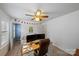 Office featuring a ceiling fan, built-in desk, and ample natural light coming in through the window at 10434 Blackstock Rd, Huntersville, NC 28078